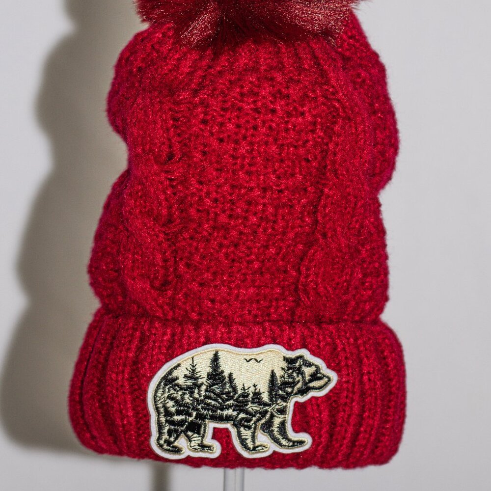 Red stocking cap with "nature bear" patch and fuzzy lining